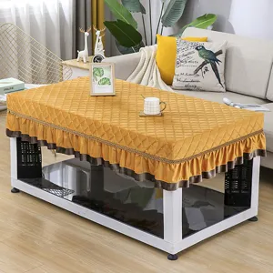 Thickened quilted heating table cover with elegant ruffles, warm yellow winter home decor.