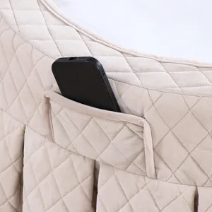 Gedetailleerd close-up van de gewatteerde fleece ronde tafelhoes met handig opbergzakje.