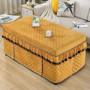 Thickened quilted rectangular table cover in warm yellow velvet with elegant ruffled edge for winter.