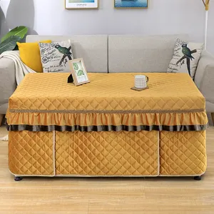 Winter heating table cover detail view, thick quilted rectangle table cloth in warm yellow.