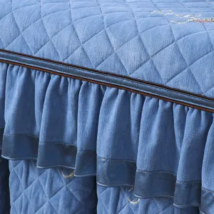 Quilted heating table cover fabric detail, thick blue velvet tablecloth with ruffles.