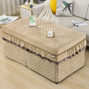Thickened rectangular heating table cover with quilted design and elegant ruffles for winter warmth.