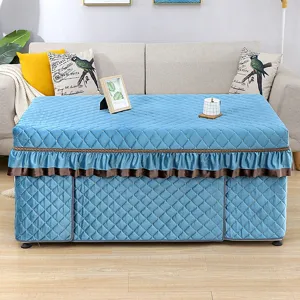 Detailed view of the thickened blue quilted heating table cover with elegant ruffles for winter.