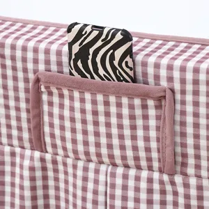 Detailed view of the soft flannel plaid table cover pocket, showcasing fine fabric texture.