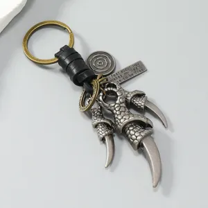 Vintage alloy eagle claw keychain with leather rope and engraved metal tag detail