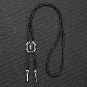 Detailansicht einer Vintage-Western-Bolo-Krawatte mit schwarzem Edelstein und Kordel.
