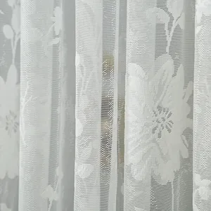 Close up view of white Korean style lace curtain with delicate floral mesh pattern detail.