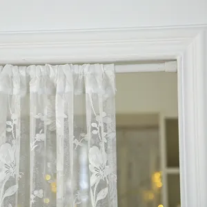 Detail shot of white vintage lace short door curtain featuring floral embroidery for room privacy.