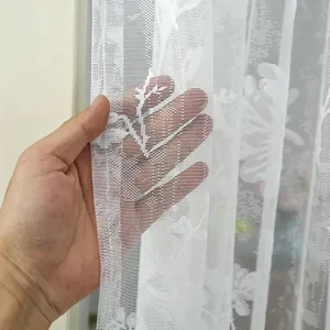 Detail view of Korean style white lace floral curtain fabric showing soft semi-transparent texture.