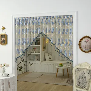 French vintage lace door curtain detail, blue floral embroidery and hanging beads design.