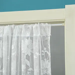 Close up view of white lace short curtain, floral sheer door curtain for home room decor.