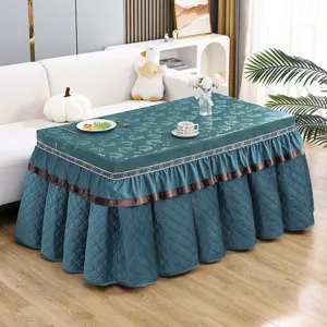 Detailed view of the rectangular electric heater table cover in dark teal with fleece design.
