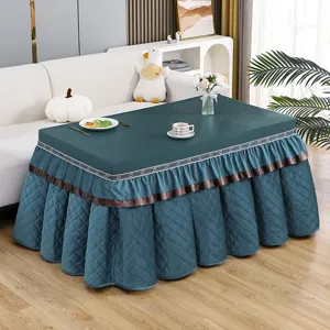 Thickened quilted dark green rectangular heater table cover with ruffles and ribbon.