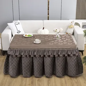 Detailed view of the thick winter electric heater table cover in elegant brown quilted style.