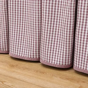 Pink checkered table cover detail view, soft fabric texture for home decor, perfect fit.
