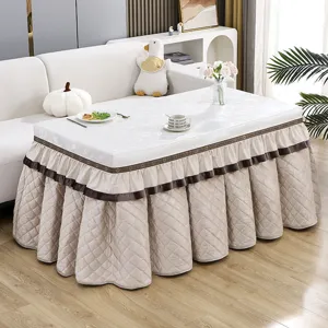 Thickened rectangular electric heating table cover with quilted skirt design for winter home decor.