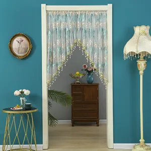 Detail view of Korean style sheer lace door curtain with blue floral embroidery and beads.