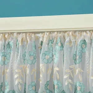 Close-up detail of Korean style lace sheer curtain with blue floral embroidery and gold leaves.