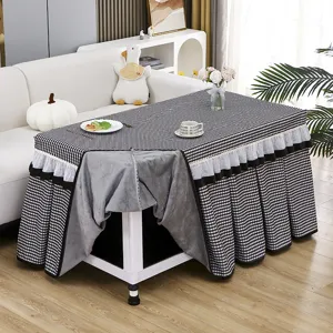 Checkered heating table cover with pleated ruffle skirt, soft fleece fabric for living room decor.