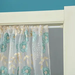 Detailed view of the Korean style sheer lace curtain with teal floral embroidery and gold leaves.