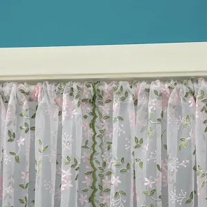 Korean lace sheer curtain detail view, white mesh with pink floral embroidery and green leaves.