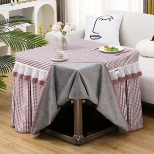 Square checkered table cover with velvet lining and ruffled skirt for heating or coffee table.