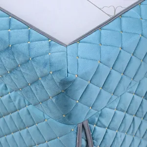 Thickened quilted blue heating table cover fabric detail, soft winter warm table cloth.