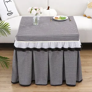 Black and white checkered table cover with white lace ruffle skirt for square table