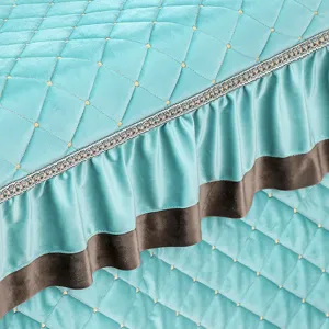 Detailed view of the quilted winter heating table cover featuring elegant ruffles and soft fabric.