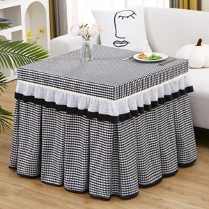 Black and white checkered table cover for heater table or mahjong machine with lace trim.