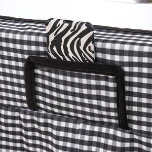 Black and white gingham table cover detail, fabric storage pocket design for home.