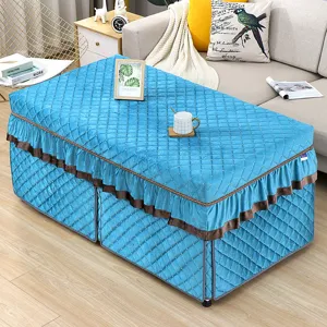 Thickened quilted rectangular heating table cover with elegant ruffles for winter home decor.