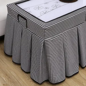 Black and white checkered table cover with pleated skirt design for square heating or mahjong tables.
