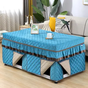 Thickened rectangular winter heating table cover blue quilted fabric with elegant ruffles.