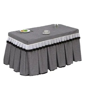 Black and white checkered table cover with ruffles for fire roasting table or coffee table.