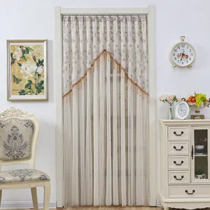 Elegant lace door curtain with exquisite floral embroidery and tassels for room decor.