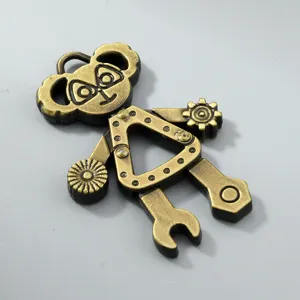 Close-up of a vintage bronze-finished moveable alloy robot pendant for DIY jewelry.
