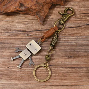 Vintage robot keychain with genuine leather wrap and brass metal details for men hip-hop style
