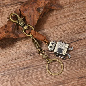 Detail view of a retro steampunk robot keychain crafted from genuine leather and bronze metal.