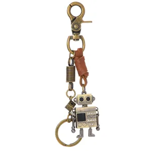 Vintage brass robot keychain with brown leather cord and metal dice pendant charm for men