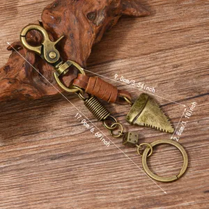 Retro bronze metal keychain with leather wrap, shark tooth charm and die pendant