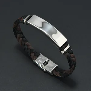 Macro view of braided leather men's bracelet with a polished stainless steel ID plate