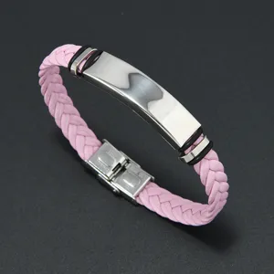 Detailed view of a pink braided leather bracelet with a polished stainless steel ID plate