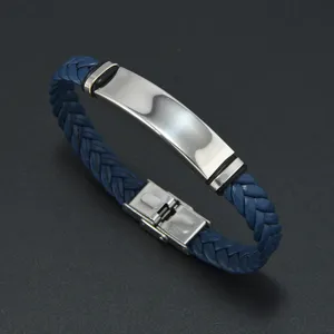 Detailed shot of a men's blue braided leather bracelet with a stainless steel ID plate