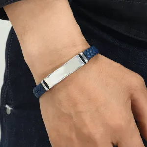 Detailed view of blue braided leather bracelet with a polished stainless steel plate
