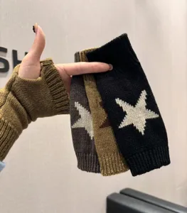 Knit fingerless gloves with star pattern, warm winter arm warmers for women and girls.