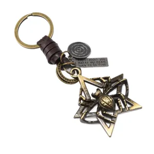 Antique bronze spider pentagram keychain with leather cord and engraved metal charms.