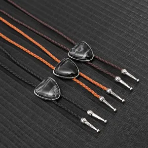 Close-up of vintage PU braided bolo ties with triangular stone pendants and metal tips