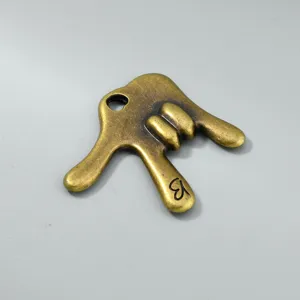 Vintage antique bronze rock on hand gesture pendant with engraved letter B detail for DIY.
