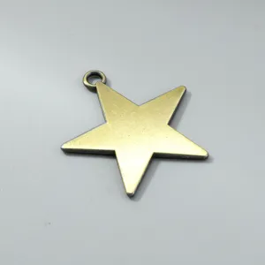 Detailed macro view of a vintage brass star pendant for DIY jewelry necklace making